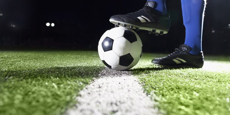 Foot on soccer ball