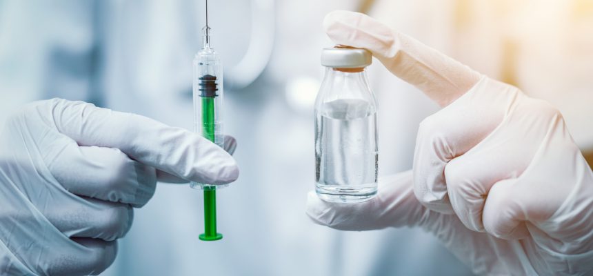 Syringe, medical injection in hand. Vaccination equipment with needle.