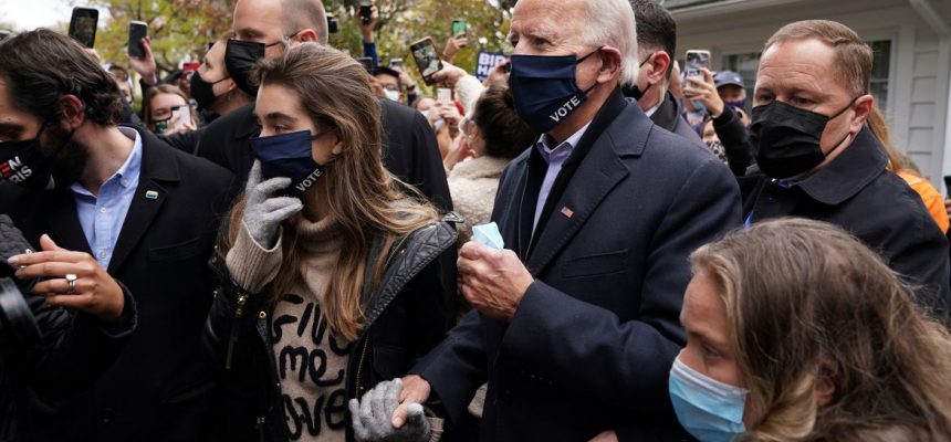 U.S. Democratic presidential nominee Joe Biden makes his way through the crowd outside of his childhood home on Election Day in Scranton, Pennsylvania, U.S. November 3, 2020. REUTERS/Kevin Lamarque