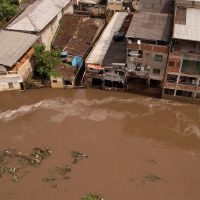 An aerial view shows a flooded street, caused due to heavy rains, in Itajuipe, Bahia state, Brazil December 27, 2021. Picture taken with a drone. REUTERS/Amanda Perobelli